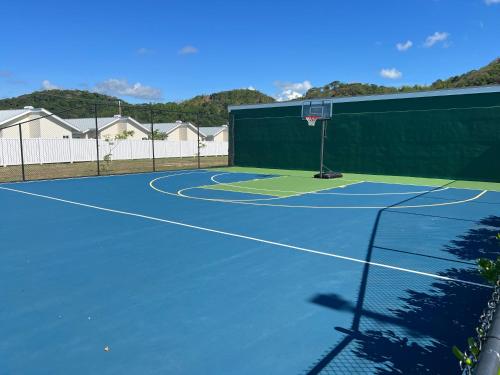 a tennis court with a net on top of it at Serenity Get Away in Lucea