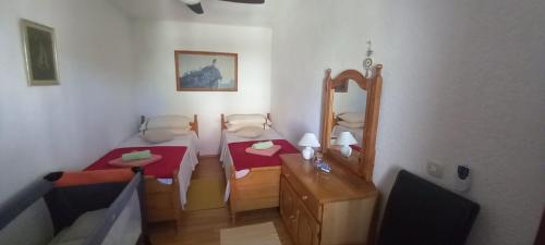 Llit o llits en una habitació de Apartment Bougainvillea