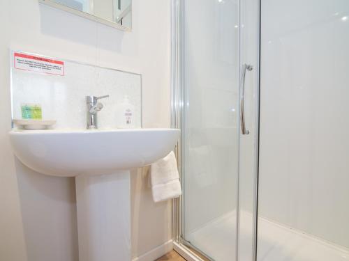 a bathroom with a sink and a shower at Pass the Keys Beautiful apartment with stunning views in Worcester