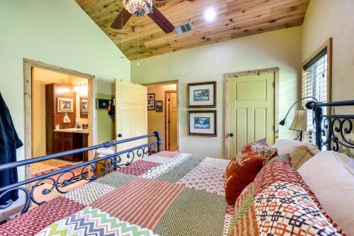 a bedroom with a bed and a wooden ceiling at Flag Hole Riverfront Cabin Near Local Attractions! in Glenwood
