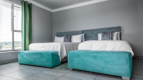 Postel nebo postele na pokoji v ubytování Greenlake Guesthouse