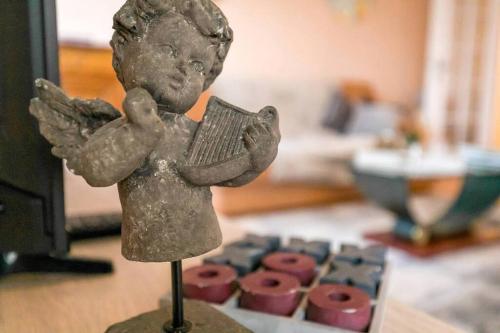 Ένα ή περισσότερα κρεβάτια σε δωμάτιο στο le 4 Saisons