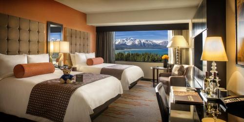 a hotel room with two beds and a large window at Golden Nugget Lake Tahoe in Stateline