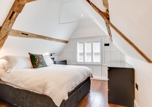 a bedroom with a bed and a window at Longmace in Arundel