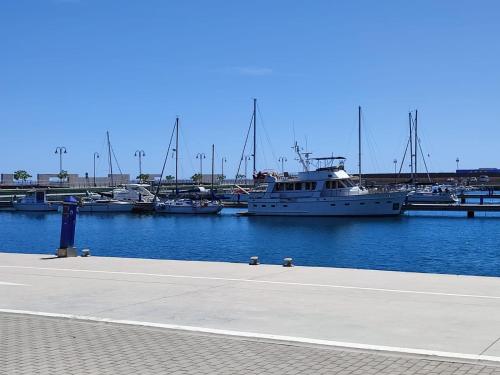 a group of boats docked in a harbor at Tranquila casa frente al mar in Adra