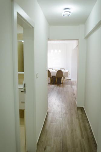 a hallway with a dining room in the background at Sweet Home in Miercurea-Ciuc