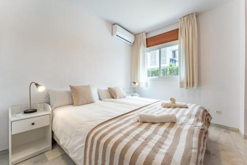 Postel nebo postele na pokoji v ubytování Apartamento Ramon y Cajal