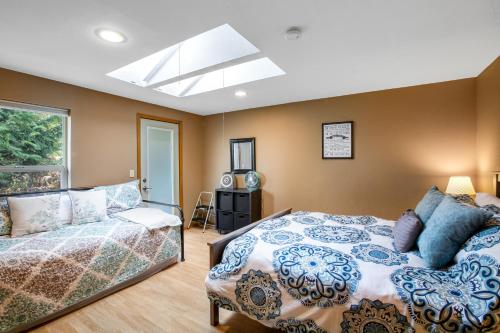a bedroom with a bed and a window at Olympus View Home in Port Ludlow