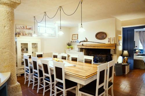 a kitchen and dining room with a table and chairs at Lake experience! in Marone