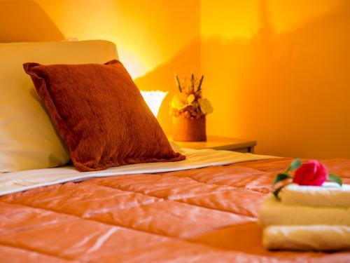 a close up of a bed with a pillow on it at Apartments Stella del Mare in Risan