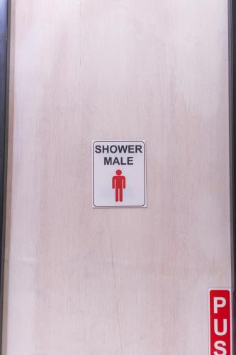 a sign that says shower make on a door at Bamboo Ubud Hostel in Ubud