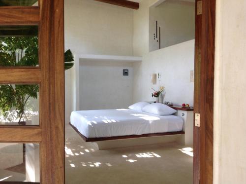 Säng eller sängar i ett rum på Casa Flor de Mar