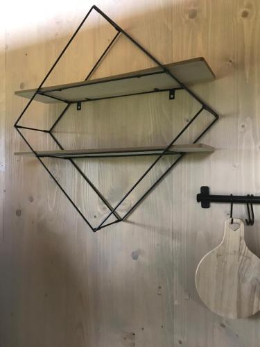 a glass shelf hanging on a wall at ranč JEZINKA, ubytování na posedu in Kardašova Řečice