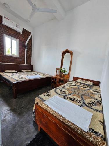 Katil atau katil-katil dalam bilik di Aloe Vera villa