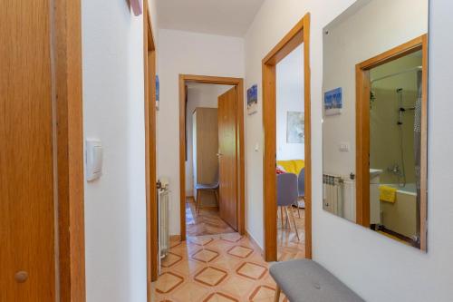 a corridor of a room with a bathroom at Apartment Hedonist in Hvar