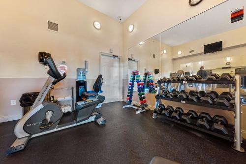 a gym with treadmills and cardio equipment in a room at Treasure Island 0303 in Panama City Beach