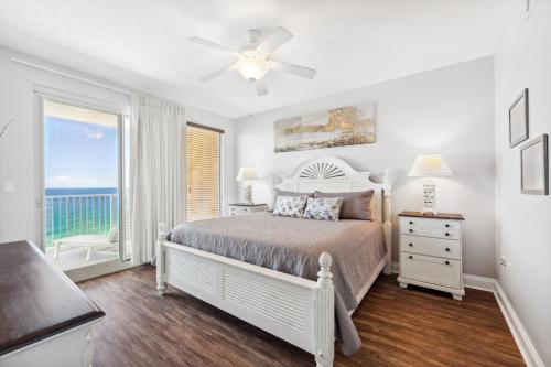 a bedroom with a bed with a view of the ocean at Treasure Island 2109 in Panama City Beach