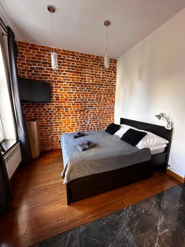Ένα ή περισσότερα κρεβάτια σε δωμάτιο στο Magic Sopot Apartments