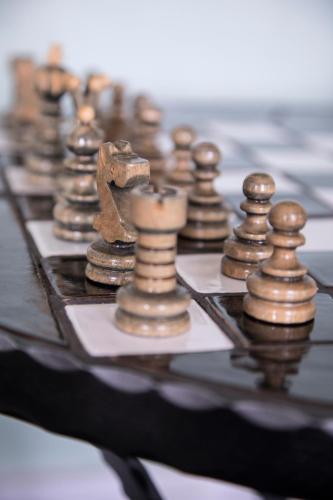 a close up of a chess board with chess pieces at Hotel Klostergaarden in Allinge