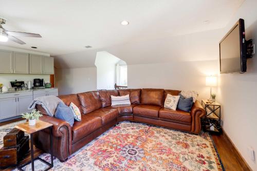 a living room with a brown leather couch at Deck, Grill and Mountain Views Banner Elk Retreat! in Banner Elk