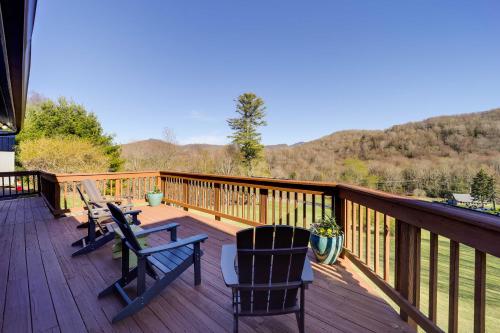 a deck with two chairs and a table at Deck, Grill and Mountain Views Banner Elk Retreat! in Banner Elk