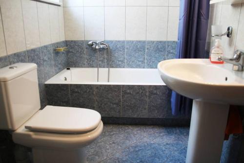 a bathroom with a toilet and a sink at Anna Kavros appartment in Chania Town