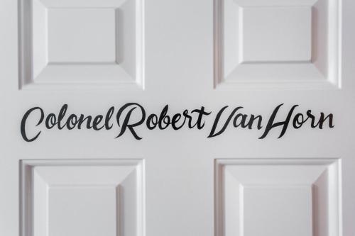 four white doors with the words colford roast jam iron at Col Robert Van Horn at Southmoreland on the Plaza in Kansas City