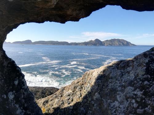 a view of the ocean from a cave at A CASIÑA DA EIRAVELLA in Hio