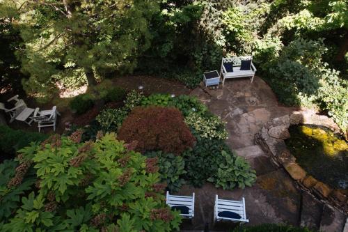 an aerial view of a garden with chairs and a pond at Ella and Jacob Loose at Southmoreland on the Plaza in Kansas City