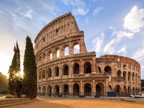 a large building in front of the coliseum at Casa Celeste Fregene, il mare di Roma in Fregene