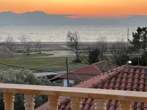 a view of the ocean from the balcony of a house at Heraklia villa sea view in Nea Iraklia