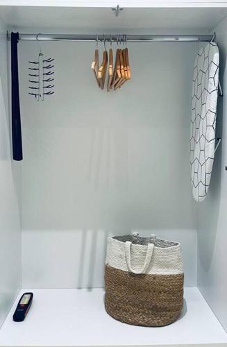 a shelf with a basket and a cell phone in a kitchen at Nespola di Campiello in Corfu