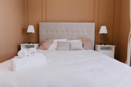 מיטה או מיטות בחדר ב-The Oasis