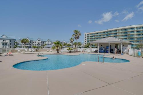 a large swimming pool in front of a hotel at Gulf Highlands Getaway with 6 Pools and Beach Access in Gulf Shores