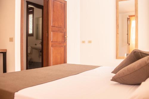 Ένα ή περισσότερα κρεβάτια σε δωμάτιο στο Hotel Al Paradise