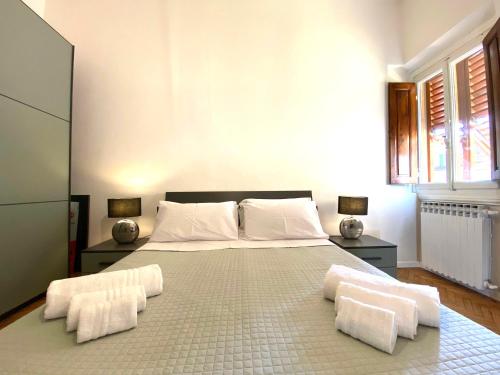 a bedroom with a large bed with two white pillows at Garibaldi 36 Apartament in San Giovanni Valdarno