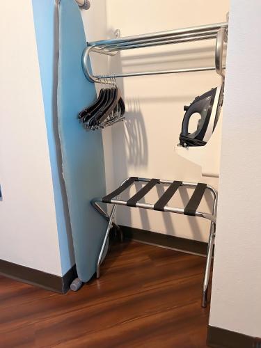 a shelf in a room with a refrigerator at La Quinta by Wyndham Bozeman in Bozeman