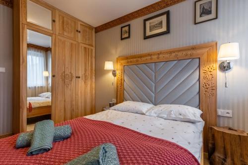 Ένα ή περισσότερα κρεβάτια σε δωμάτιο στο Apartament Tatry Mountains Zakopane