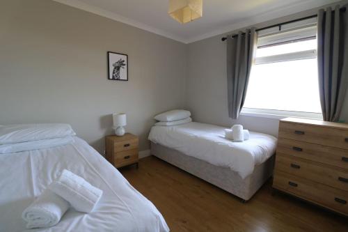Кровать или кровати в номере Borve House, Kilchoan