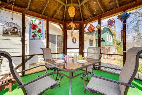 a screened porch with a table and chairs at Athens Vacation Rental - 6 Mi to Ohio University! in Athens