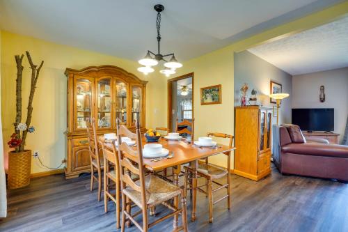 a dining room with a wooden table and chairs at Athens Vacation Rental - 6 Mi to Ohio University! in Athens