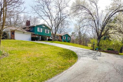 a house with a green house and a driveway at Athens Vacation Rental - 6 Mi to Ohio University! in Athens