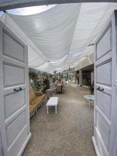 a living room with a white tent and a couch at Sotto il cielo di Toscana appartamenti in tenuta only adults no pet in Camaiore