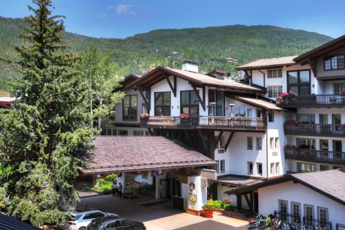 a group of houses in a town with a tree at Lodge at Vail, A RockResort in Vail