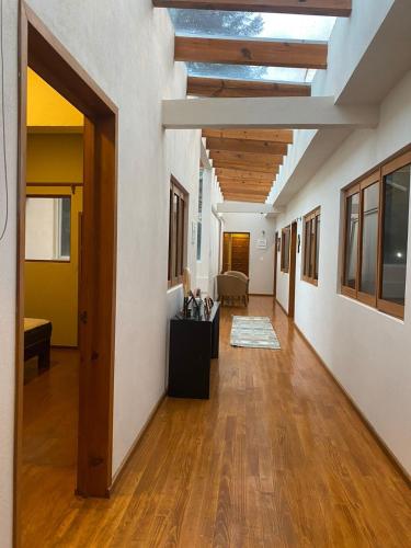 an empty hallway with a skylight in a building at Rancho Emisajumi El Ajusco in Mexico City