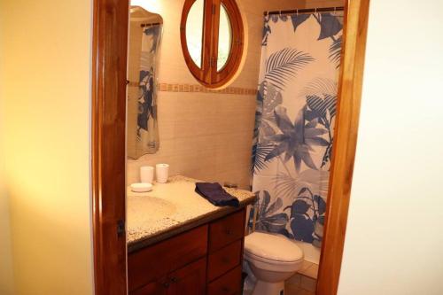 a bathroom with a sink and a toilet and a shower at Secluded Ocean Front Overlooking the Marina in San Carlos