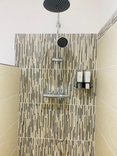 a shower with two sinks and a shower curtain at Magnifique T2 en bord de mer in Le Lavandou
