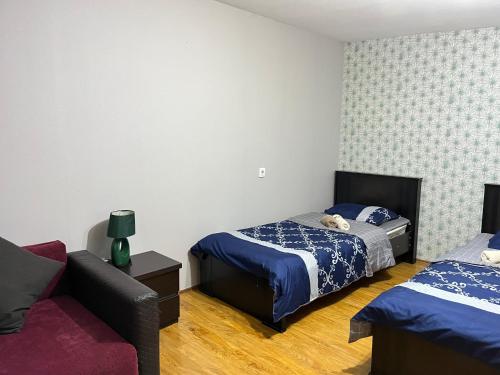 Postel nebo postele na pokoji v ubytování Guest House Zatika