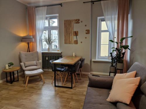 Χώρος καθιστικού στο Apartament Ratuszowy DeLuxe