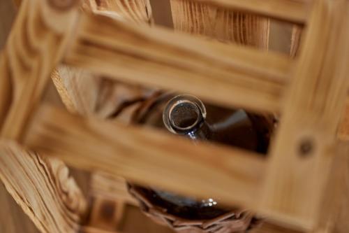 a bottle of wine in a wooden drawer at Moselhotel Weinhaus Simon `Sauna`Restaurant`ELadesäule in Wintrich